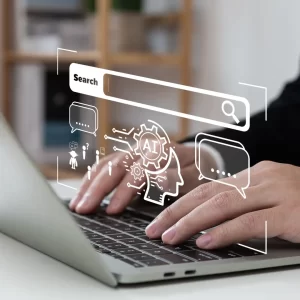 Man's hands on a laptop with a popup search that indicates that AI is working behind the scenes.