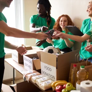 Volunteers packing boxes of donations.